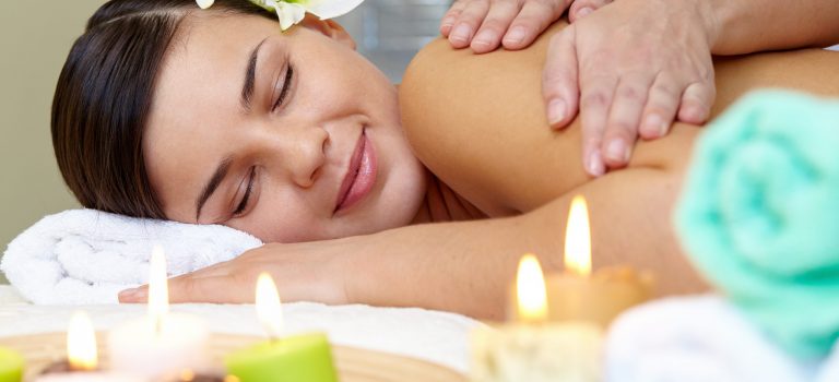 Portrait of young female enjoying the procedure of massage